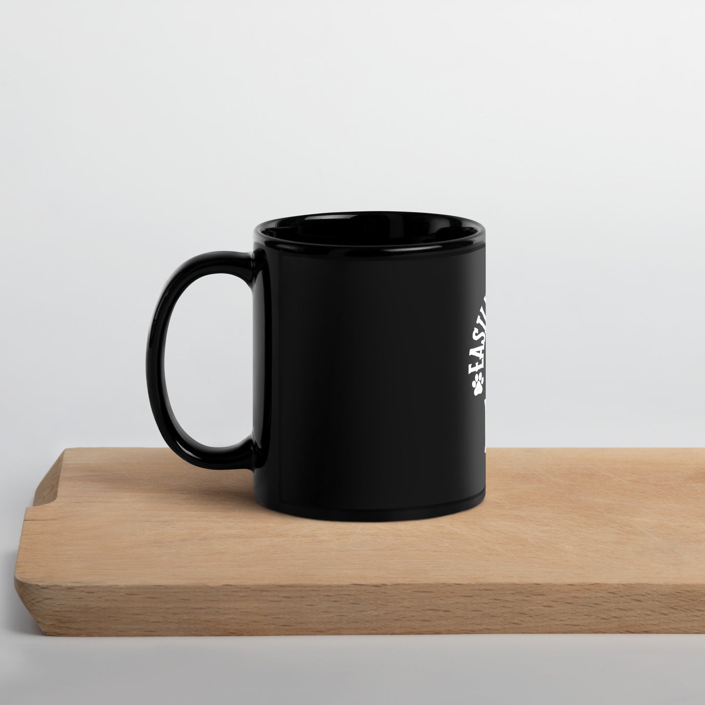 Black Glossy Mug distracted by dogs