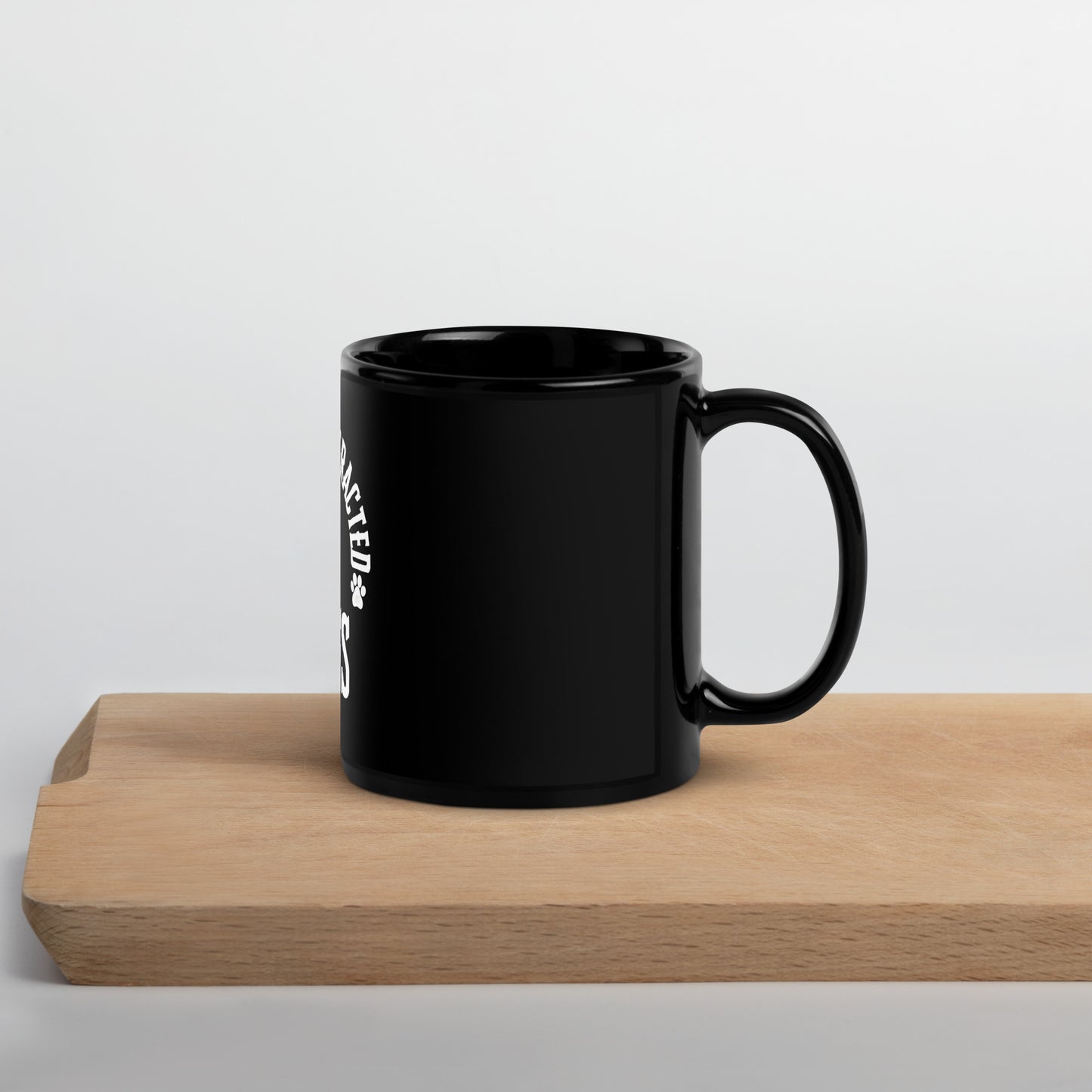 Black Glossy Mug distracted by dogs